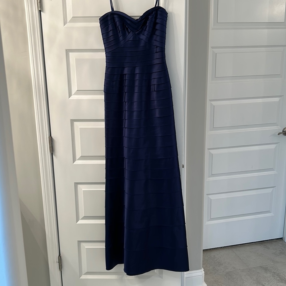 BCBG Navy strapless gown, sweetheart neckline. Built in corset/boning.